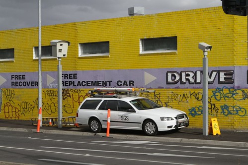 Contractor at work calibrating a combined speed and red light camera