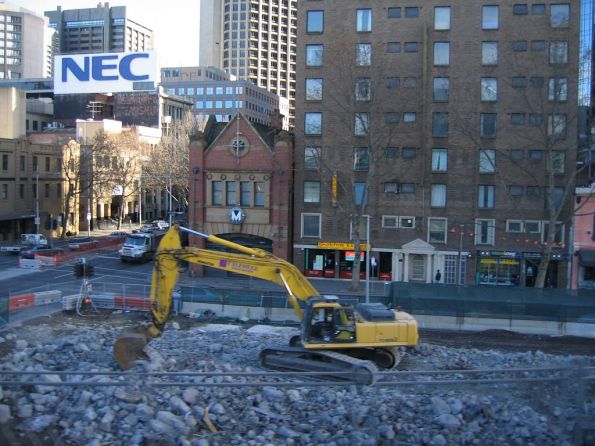 Excavator clearing the remains of the Flinders Street Overpass