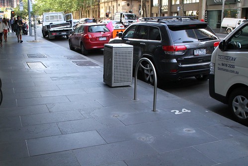 A year after the City of Melbourne said they would move them, the bike hoops at William and Bourke Street are now parallel to the kerb, instead of blocking the footpath