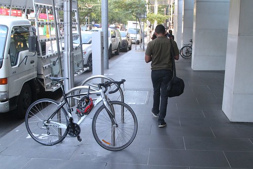 Bike racks running 90 degrees to the road and blocking the footpath at William and Bourke Street