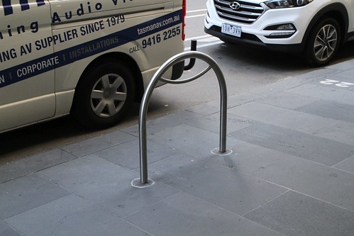 A year after the City of Melbourne said they would move them, the bike hoops at William and Bourke Street are now parallel to the kerb, instead of blocking the footpath