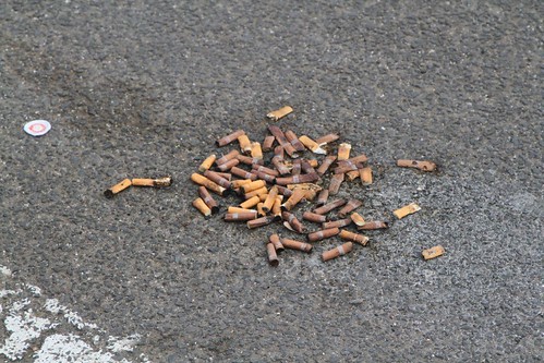 Pile of dumped cigarette butts in the Sunshine Marketplace car park