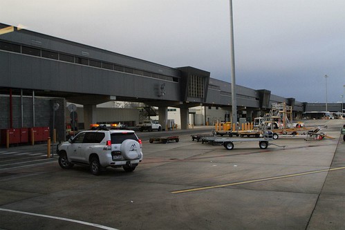 Melbourne Airport airside safety car waiting beneath terminal 4 to lead our bus out airside