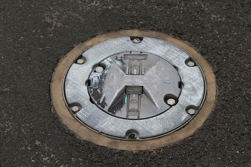 Detail of a taxiway centre light inset into the pavement