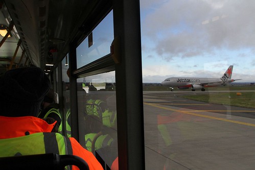 Our bus gives way to a Jetstar A320 using the taxiway ahead of us