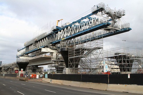 Launching gantry above Footscray Road, to erecting the westbound elevated concrete viaduct