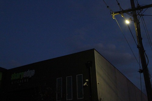 'Watchman' security lighting shine on private property from utility owned power poles