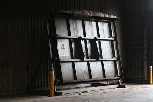 Steel door removed from a composting cell so that it can be unloaded