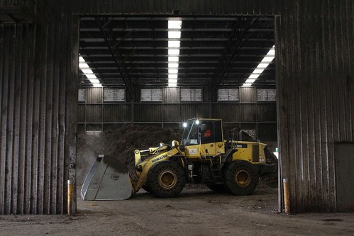 Komatsu WA380 wheel loader moving finished compost around the composting shed