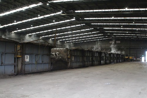 Long rows of composting cells inside the main shed