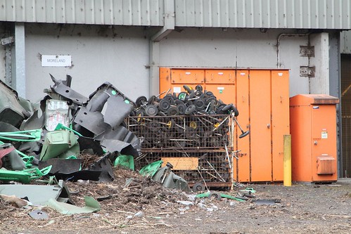 Pile of wheels removed from broken wheelie bins picked out from the incoming organic waste stream