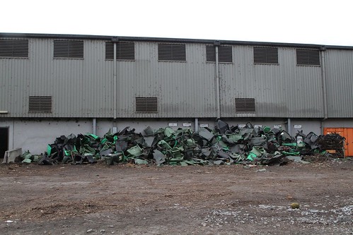 Pile of broken plastic wheelie bins picked out from the incoming organic waste stream