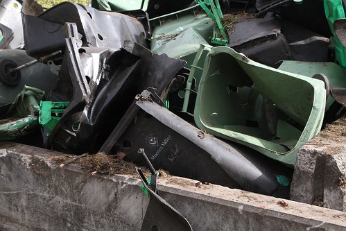 Pile of broken plastic wheelie bins picked out from the incoming organic waste stream