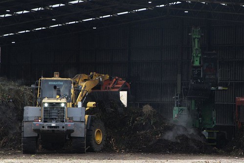 Komatsu WA380 wheel loader at work inside the shredding shed at the Veolia Bulla Organics Facility