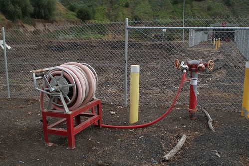 Fire hose reels beside the compost stockpiles