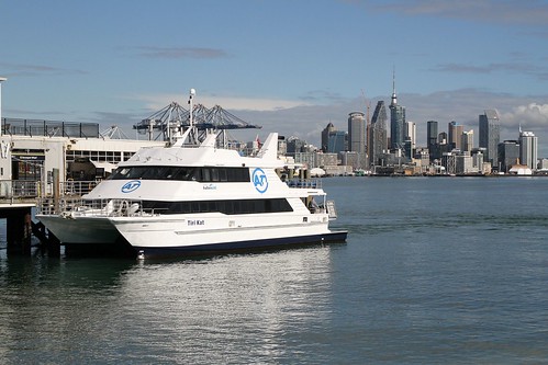 Fullers360 ferry 'Tiri Kat' at Devonport, the Auckland CBD skyline behind