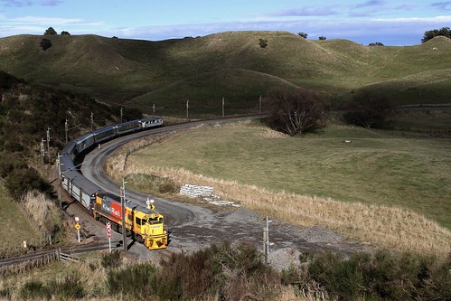 KiwiRail diesel locomotive DFB 7049 leading the northbound Northern Explorer around the horseshoe curve in the Hautapu River valley at Turangarere, outside Taihape