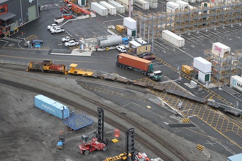 KiwiRail shunter DSG 3018 leads a rake of empty container wagons around the port sidings at Lyttelton