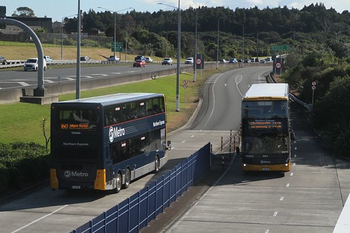 Tranzurban Auckland buses #3565 LQK86 and #3560 LQK88 pass on route NX2 along the Northern Busway at Akoranga