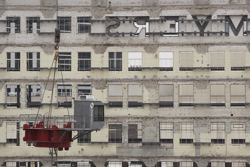 'MYERS' sign in the background as a crane is erected