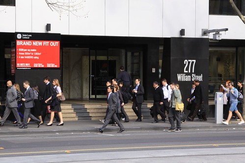 Morning commuters head down Melbourne's William Street