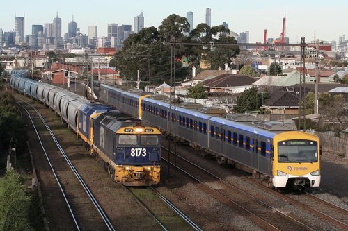 8173 and 8160 on a grain train chase a down Sydenham service at West Footscray