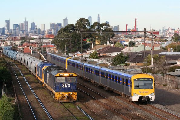 8173 and 8160 on a grain train chase down Siemens 734M on a down Sydenham service at West Footscray