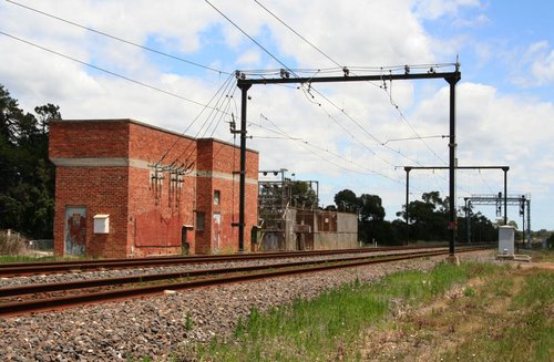 Preserved 1950s red brick traction substation and overhead wiring at Bunyip