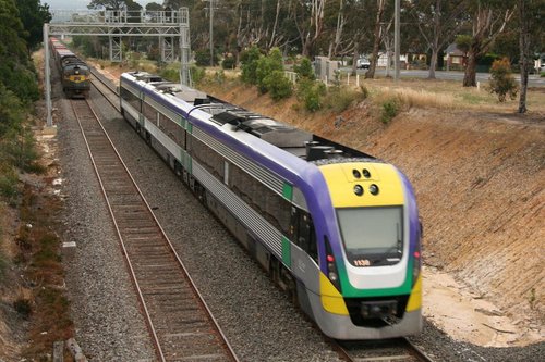 VL38 runs on the up past the freight