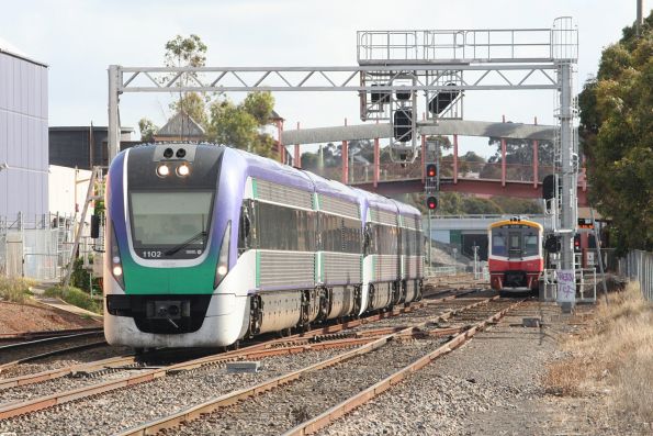 VLocity VL02 and classmate on an up express uses the middle road at Sunbury to overtake a Sprinter on a local service