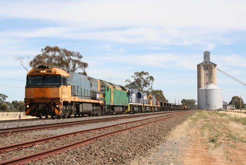 NR47 leads AN9, NSW coal fields loco 8229, NR73, and NR107 on an eastbound steel train through Lubeck