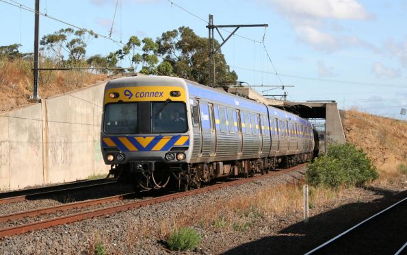 Alstom Comeng emerges from under the Jacana Flyover