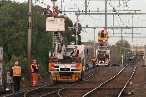 Damaged bit of overhead is between the two tracks, the contact wire is missing