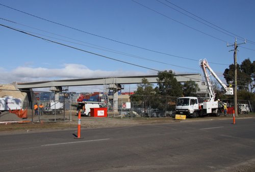 Three spans already in place, work on relocating power lines