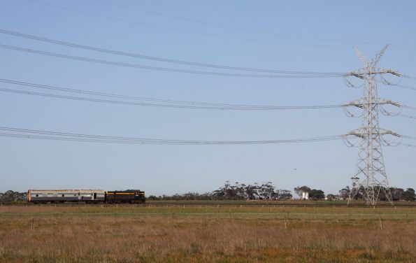 T357 and V/Line power van PCJ491 dwarfed by the power lines at Gheringhap