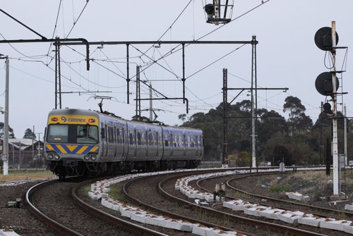 3-car Alstom Comeng departs Newport bound for Werribee, passing new concrete sleepers