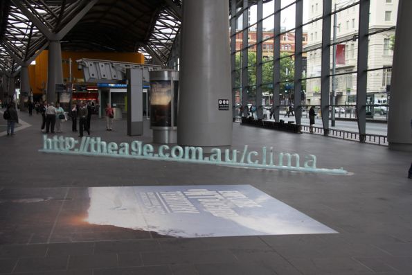 Broken 'The Age' advertising sign at the Spencer Street entrance to Southern Cross Station