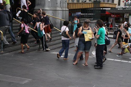 Handing out flyers for a 'Goodbye to Connex' party outside Flinders Street