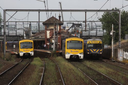 Two down Siemens and an up EDI Comeng at Footscray, the new footbridge lurks behind