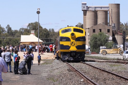 Crowds throng the platform, including Santa