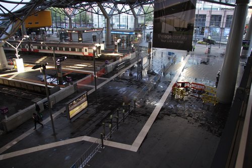 Puddles on the concourse from the storm damage