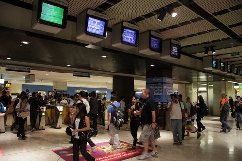 TV screens and ticket barriers at the Swanston Street end of Melbourne Central