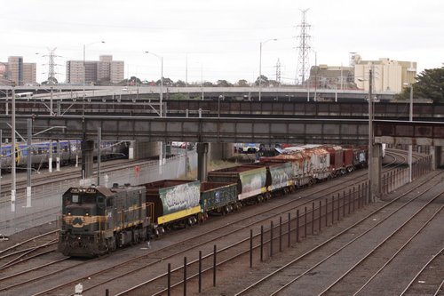 P22 clear of the signal, briquette hoppers behind the loco