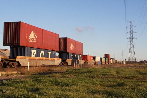 53 foot containers stacked atop 40 foot containers in well wagons