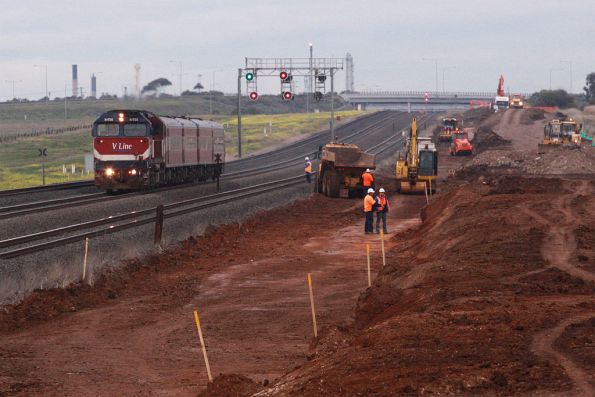 Up train passing work on the new Elders Loop on the standard gauge at Lara