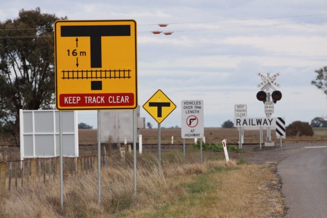 'Keep track clear' and 'No right turn' signs all addressed to trucks