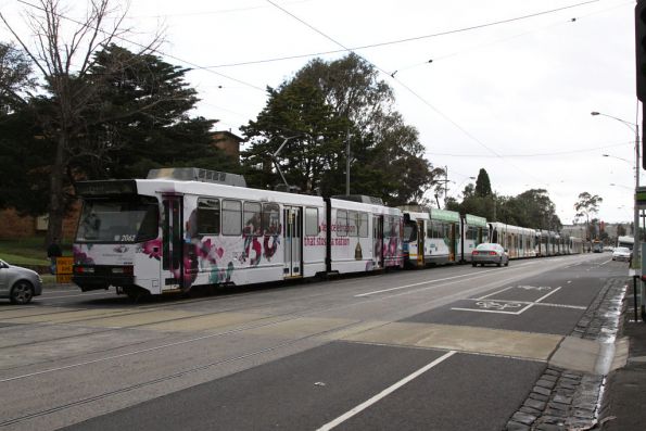 Four B2s and two D2 class trams sit in the Showgrounds Loop to collect Melbourne Cup patrons after the race