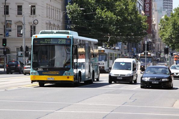 National Bus #545 rego 5841AO on a route 238 service along Flinders Street beside the Viaduct