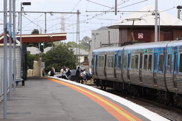 The level crossing finally opens at Yarraville, letting the passengers past