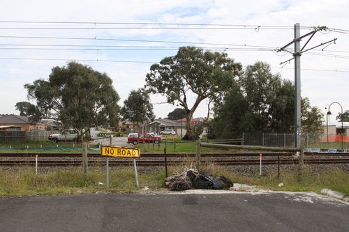 Dead end of Aylmer Road at the railway crossing, looking west